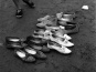 Shoes left on beach in preparation for Salish canoe races in North Vancouver, 1962