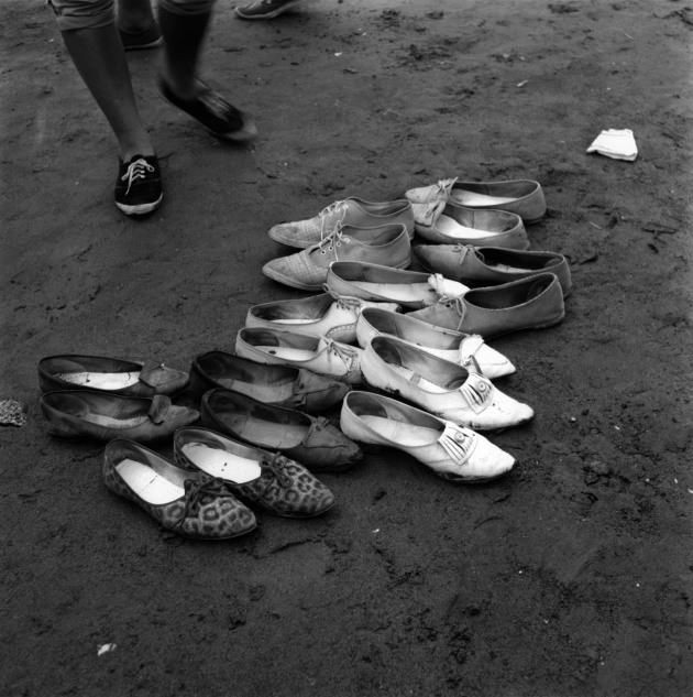 Shoes left on beach in preparation for Salish canoe races in North Vancouver, 1962