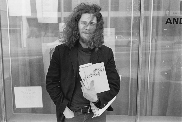 Ed Varney with his first book of poetry, Ed Varney, Michael de Courcy, 1970